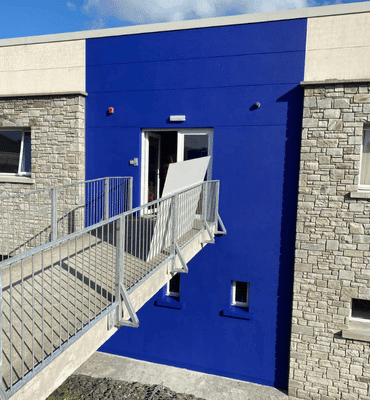 External after painting photo of commercial office in deep blue by Cornelius Green Decorators