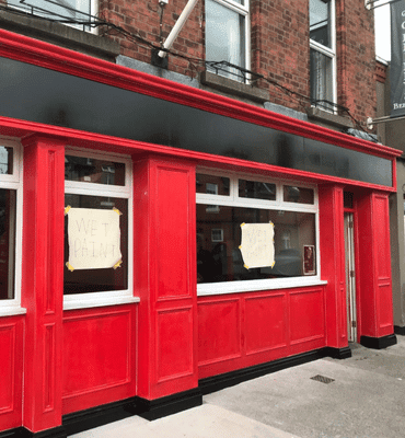 External in progress painting photo of O'Reilly's Beer Garden by Cornelius Green Decorators
