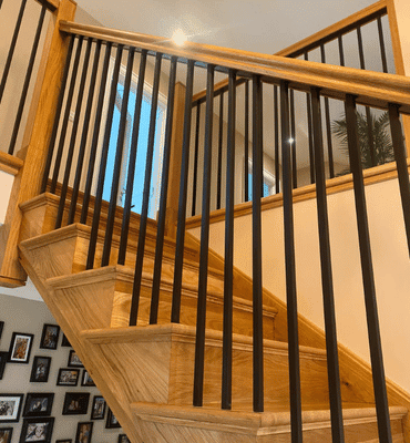 Interior after photo of a staircase and entryway revamp and paint.