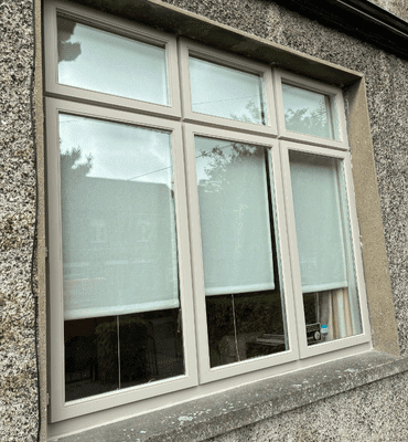 External completed spray painting photo of window with white edges by Cornelius Green Decorators