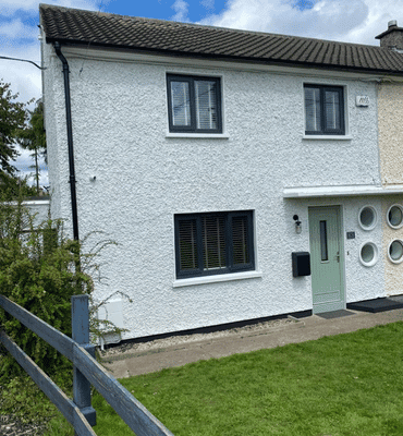 External completed spray painting photo of residential home in white by Cornelius Green Decorators