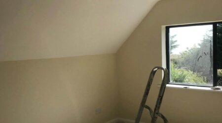 In progress Interior painting photo of a converted attic living room revamp and paint.