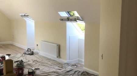 Before Interior painting photo of a converted attic living room revamp and paint.