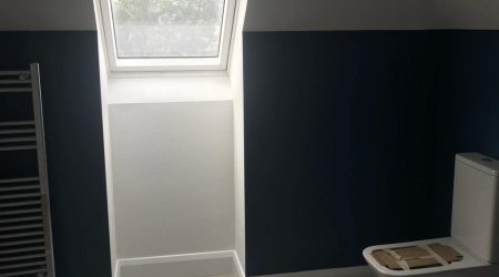 In progress residential bathroom dual tone white and navy blue interior painting by Cornelius Green Decorators in Dublin