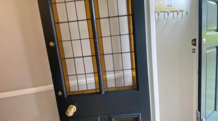 In progress interior painting of residential home internal front door by Cornelius Green Decorators