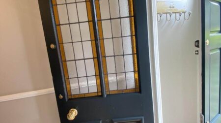 In progress interior painting of residential home internal front door by Cornelius Green Decorators