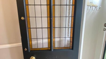 In progress interior painting of residential home internal front door by Cornelius Green Decorators