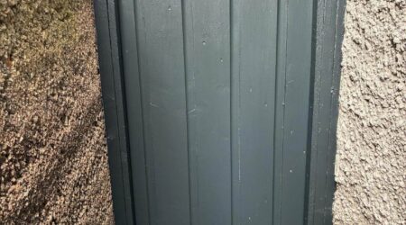 Exterior after painting photo of a dark green side gate by Cornelius Green Decorators