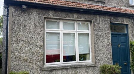 Before exterior painting of residential home front door and windows by Cornelius Green Decorators