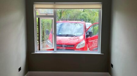 Completed Interior painting of residential room in sea green and white trim by Cornelius Green Decorators