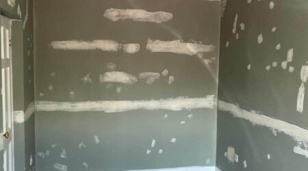 Before Interior painting of residential room in sea green and white trim by Cornelius Green Decorators