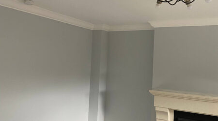 Completed Interior painting of residential living room in egg shell blue and white trim by Cornelius Green Decorators