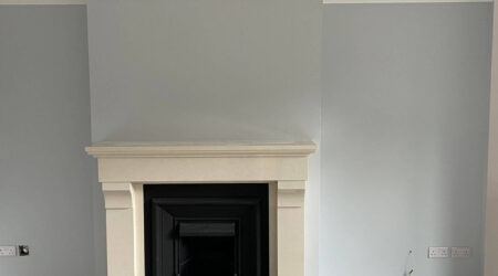 Completed Interior painting of residential living room in eggs hell blue and white trim by Cornelius Green Decorators