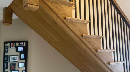 Completed photo of a staircase, landing and entryway revamp and paint by Cornelius Green Decorators