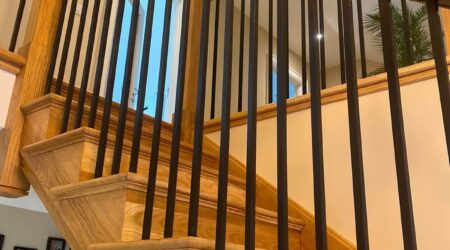 Completed photo of a staircase, landing and entryway revamp and paint by Cornelius Green Decorators