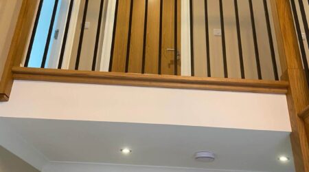 Completed photo of a staircase, landing and entryway revamp and paint by Cornelius Green Decorators