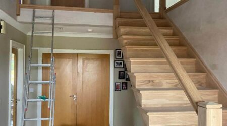 In progress photo of a staircase and entryway revamp and paint.