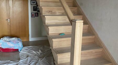 In progress photo of a staircase and entryway revamp and paint.