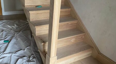 In progress photo of a staircase and entryway revamp and paint.