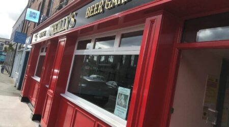 Completed Exterior red and black facade painting photo of O'Reilly's Beer Garden by Cornelius Green Decorators