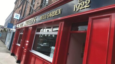 Completed Exterior red and black facade painting photo of O'Reilly's Beer Garden by Cornelius Green Decorators