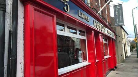 Completed Exterior red and black facade painting photo of O'Reilly's Beer Garden by Cornelius Green Decorators