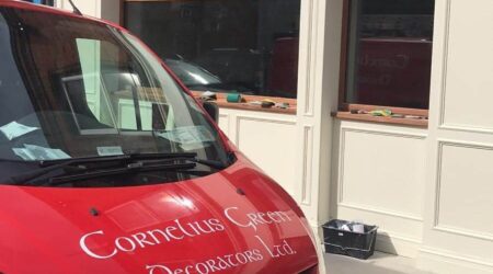 Before exterior painting photo of O'Reilly's Beer Garden with Cornelius Green Decorators van