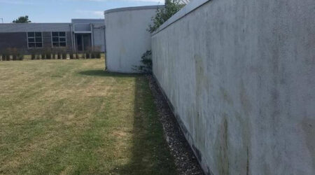Before External spray painting photo of residential boundary wall in white by Cornelius Green Decorators