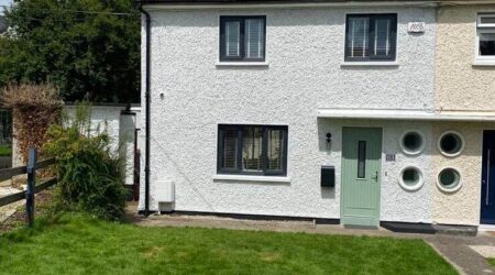 External completed spray painting photo of semi detached residential home in white by Cornelius Green Decorators