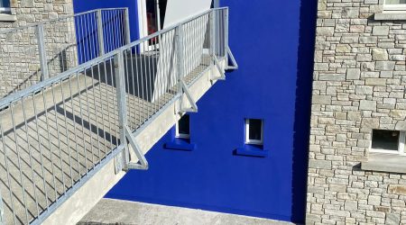 External after painting photo of commercial office in deep blue by Cornelius Green Decorators