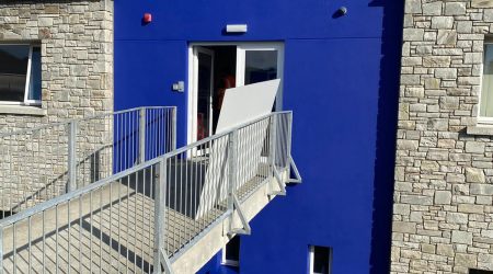 External after painting photo of commercial office in deep blue by Cornelius Green Decorators